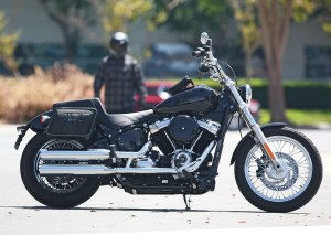 Photo of man walking to motorcycle with saddlebags installed